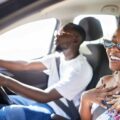 African couple driving in car on holiday, smile for travel on vacation in summer and conversation | Carrying Passengers Roads With A Learners Licence in South Africa