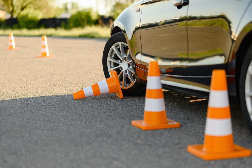 Car and downed cone, driving school | Alley docking is a challenging yet essential maneuver that forms a significant part of the K53 Driving Licence test