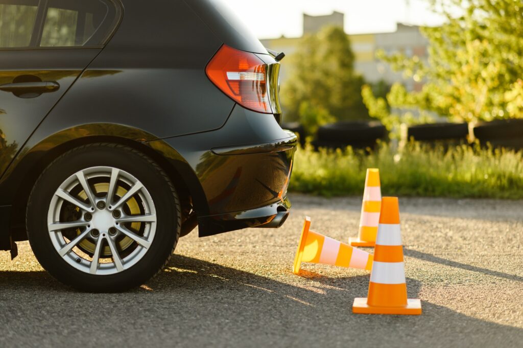 Car and traffic cones driving school | The Importance of Alley Docking in the Driving Licence Test