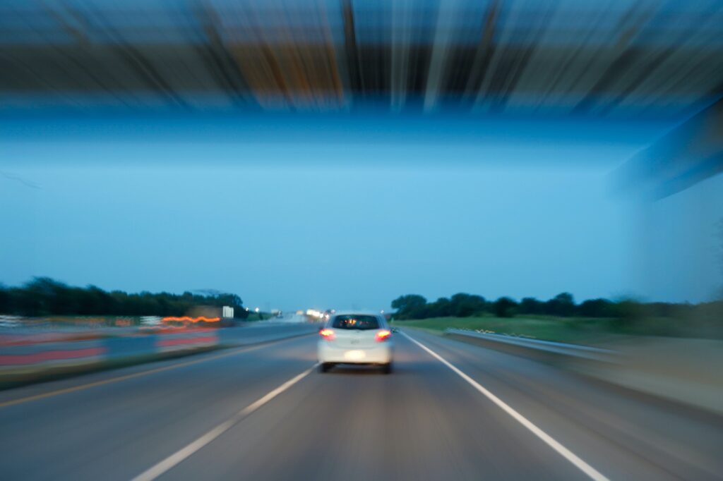 Car driving in blur of speed