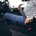 Art of Moving Off | Step-by-Step Guide to Confident Starts | Close Up Of Female Driver In Car Fastening Seatbelt At Start Of Journey