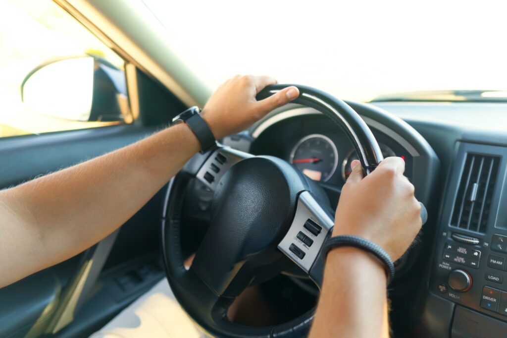 Driver's hands on a steering wheel | Mastering Steering Techniques for Success in a K53 Driving Licence Test