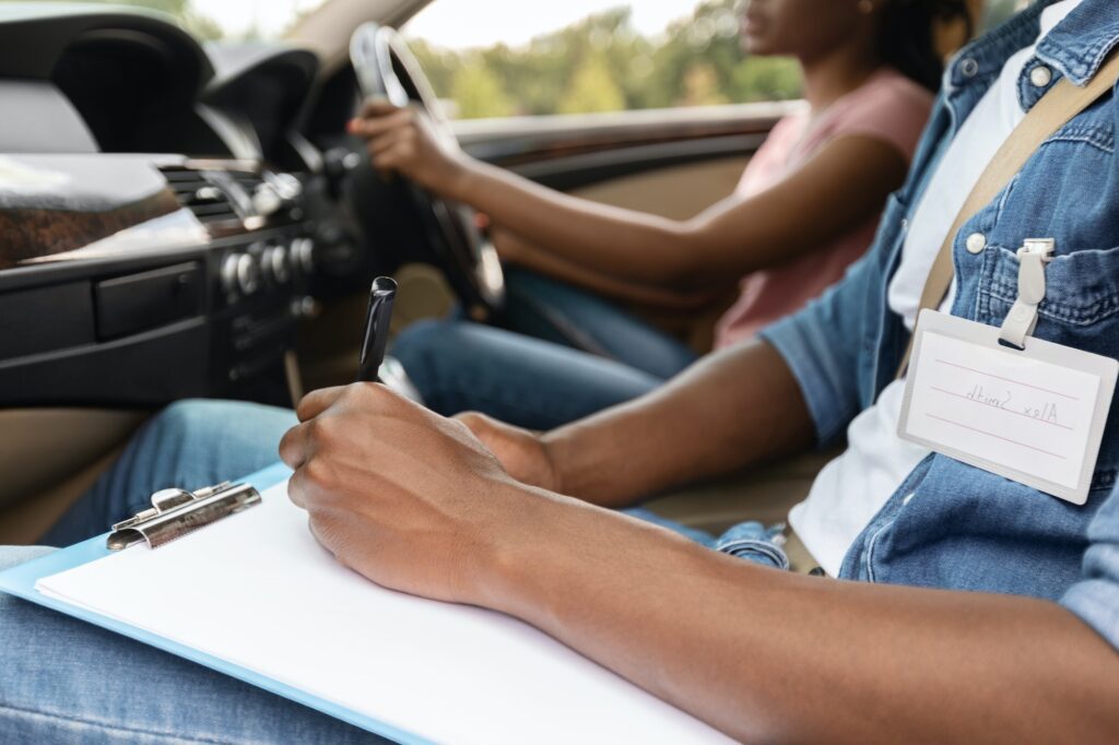 Driving Instructor Writing Down Results Of Exam, Validity of a Learners Licence