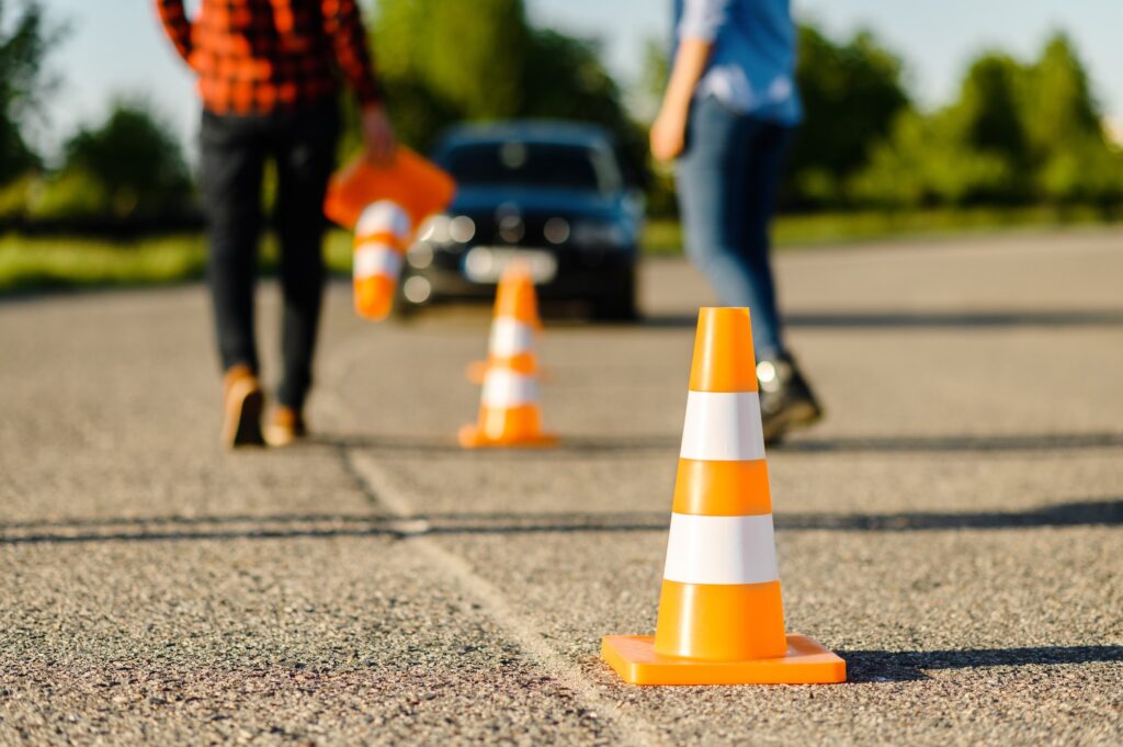 Instructor and student on road with traffic cones | Mastering Yard Test Manoeuvres: Ace Your K53 Driving Licence Test