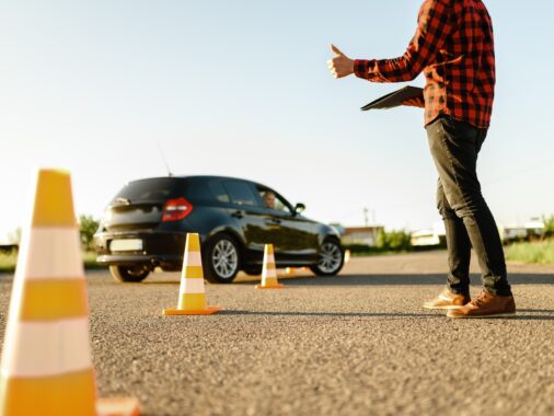 Instructor helps student to drives between cones | Maximizing the Validity of Your Learners Licence