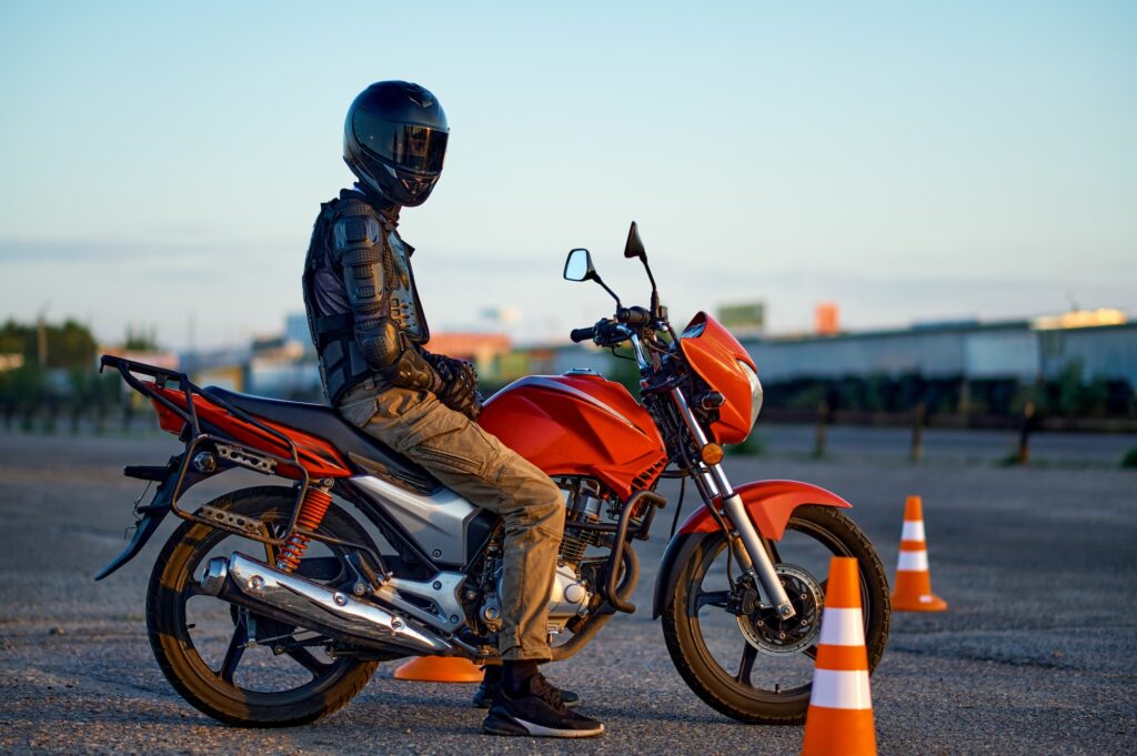 Male student poses on motorbike, motorcycle school | K53 Motorcycle Test Preparation is Key: Roadworthiness and Mounting Skills