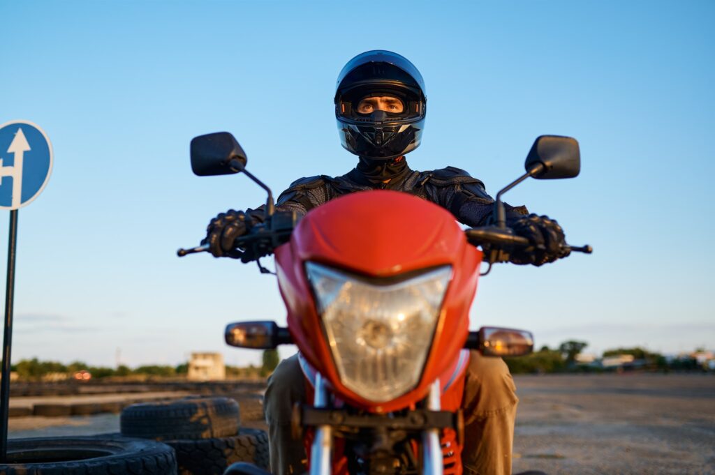 Man on motorbike, front view, motorcycle school | Mastering the K53 Motorcycle Test: Essential Skills for Two-Wheeled Success