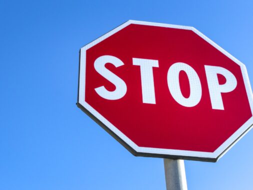 Red stop road sign and blue sky | K53 Control Signs | Pass Your Learners Licence in South Africa