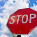 Red stop sign on the street, roadside traffic for stopping. | K53 Regulatory Signs