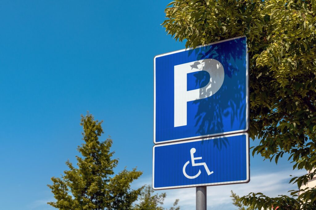 Reserved parking space sign, handicapped person with disability in wheelchair pictogram | K53 Reservation Signs