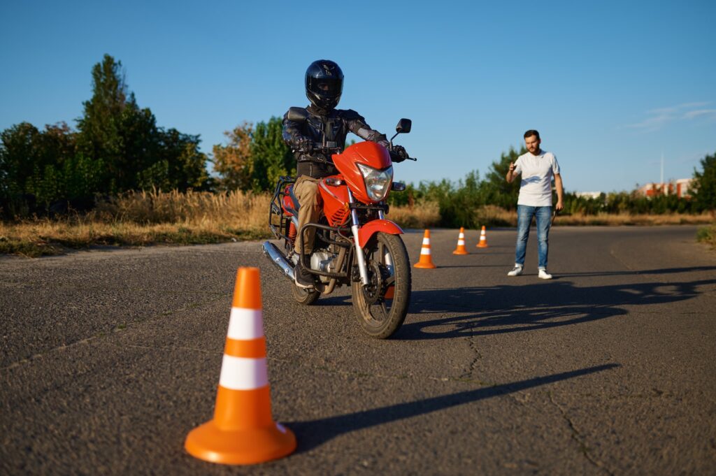 Student and instructor, exam in motorcycle school | Mastering the K53 Motorcycle Test requires a combination of skill, knowledge, and practice.