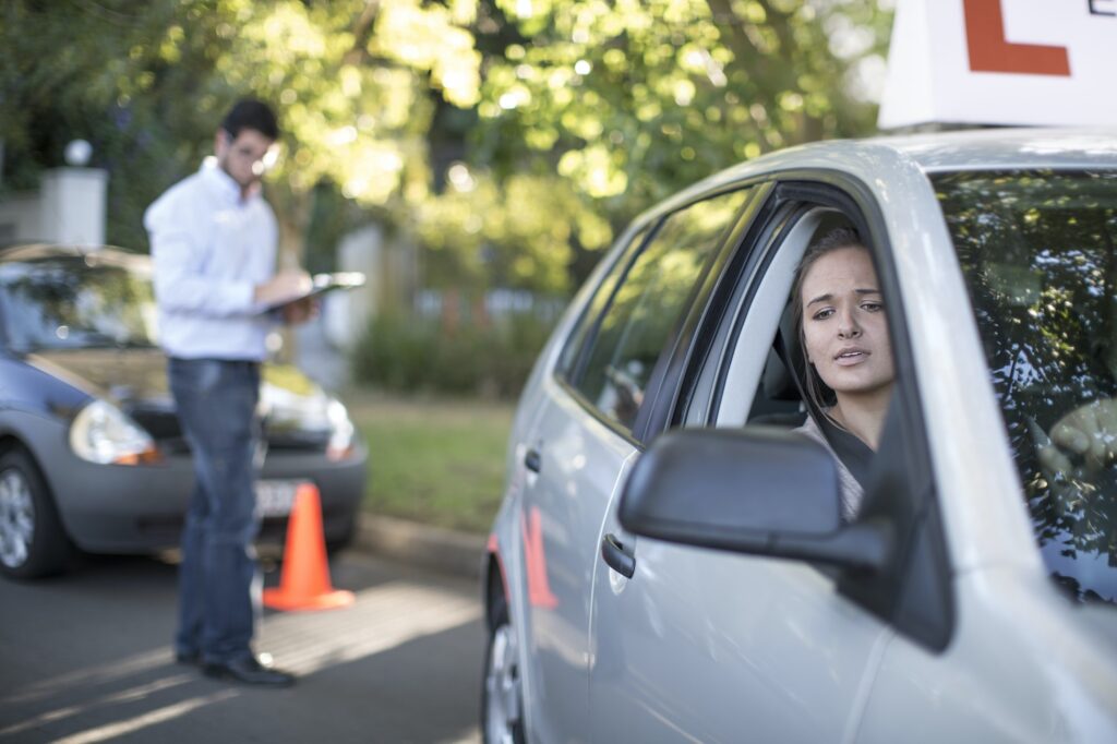 Mastering the Left Turn Yard test Manoeuvre For the Yard Test: Teenage girl during driving license test