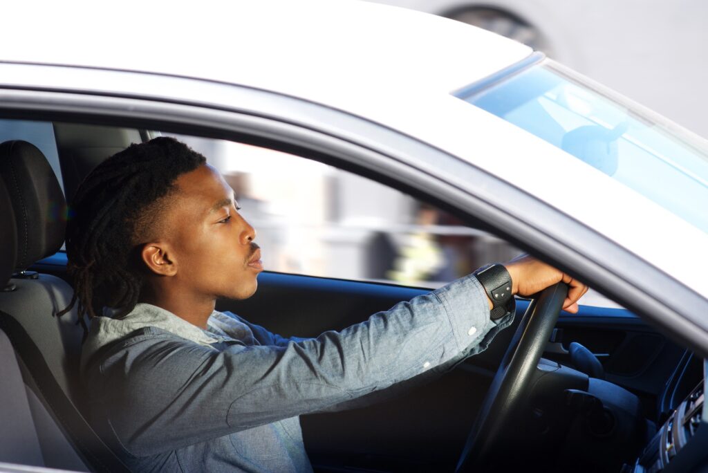 Young black man driving car |  Join Our K53 Community - Supportive and Free!