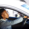 Young black man driving car | Join Our K53 Community - Supportive and Free!